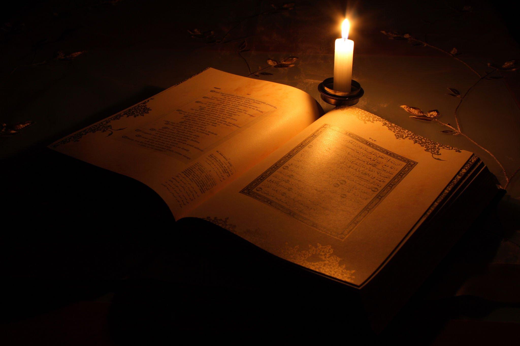 httpswww.istockphoto.comphotoholy-koran-laying-open-on-a-desk-with-one-lit-candle-gm174901607-2286482phra